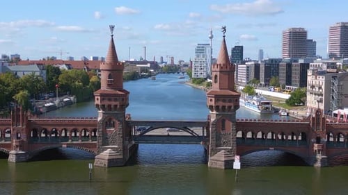 Summer day east west Berlin Border River Bridge Germany. Dramatic aerial top view flight ascending d
