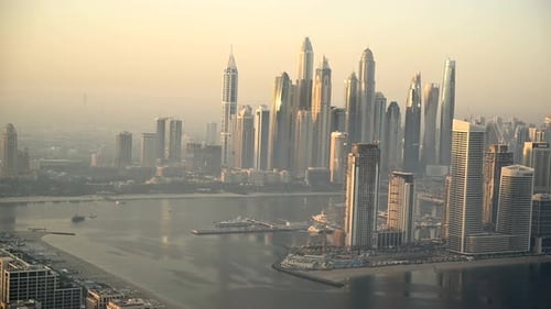 A View of a Large City with a River Running Through It During Sunrise in Dubai UAE