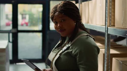 Warehouse Supervisor Holding Tablet