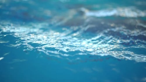 Gentle Ocean Waves Under Bright Blue Sky