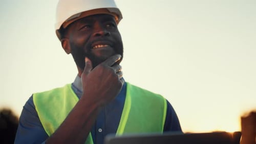 Pensive Man Looking at Laptop Display and Thinking About Construction Project Portrait of African