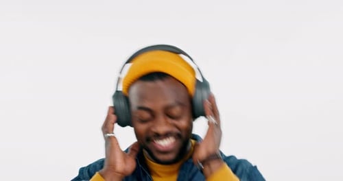 Music headphones, dancing or happy black man streaming in studio for freedom on white background