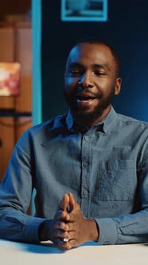 Man Speaking and Gesturing Indoors