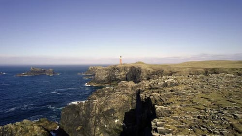 Aerial view of lighthouse and cliffs, Scotland.