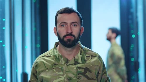 Man in Military Camouflage Uniform in Data Center