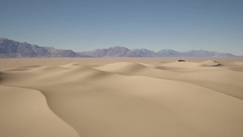 Desert Landscape With Distant Mountains