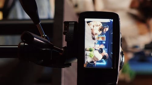 Camera Displays Two Adults in a Recorded Conversation