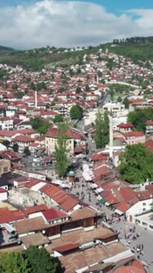 Aerial Establishing Shot of City With Red Roofs