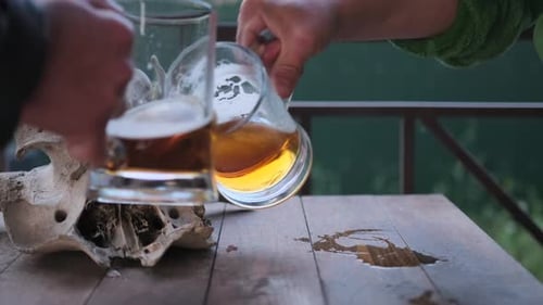 Beer Poured Next to Animal Skull on Table