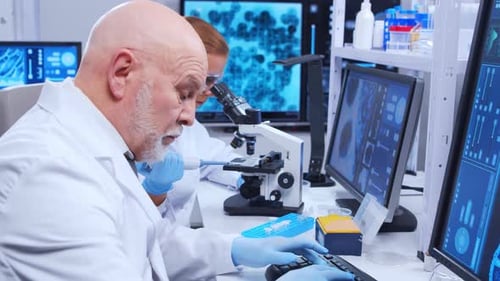 Scientists Work with Microscopes and DNA Analysis