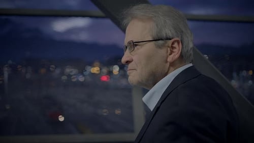 Man Looking at City Lights at Night