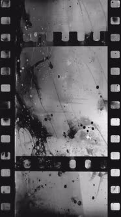Dirty 35Mm Film Strip with Sprocket Holes