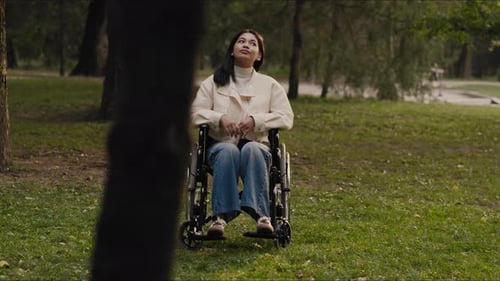 Woman in Wheelchair Enjoys Day in the Park