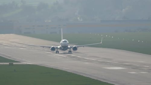 Passenger aircraft takes off on a beautiful morning from the bustling airport