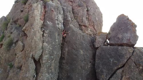 Climbing woman in the mountain. Drone view of climber sportsmen.Physical activity in the countryside