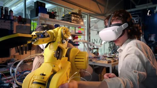Young Adults Controlling Robotic Arm with VR Headsets