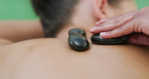 Hot Stone Massage on Bare Back