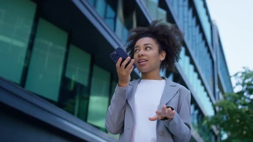 Businesswoman Using Phone in City