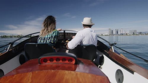 Couple Boating on the Water with City Skyline