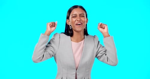 Excited Woman Cheering in Front of Blue Background