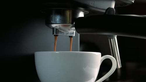 Pouring Coffee Stream From Machine in Cup Pouring Coffee Stream From Machine in Cup Flowing Fresh