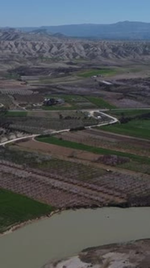 Aerial View Over Fertile Land Near the River