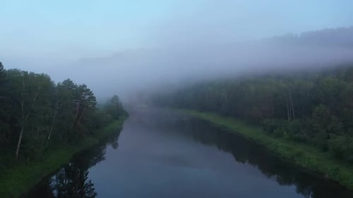Aerial View of Morning Haze Over Calm River Surface Tranquil Scene with River
