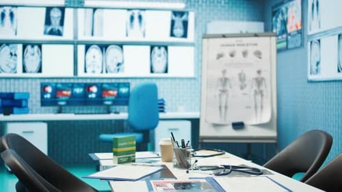 Empty Doctor's Office with X-Rays and Medical Diagram