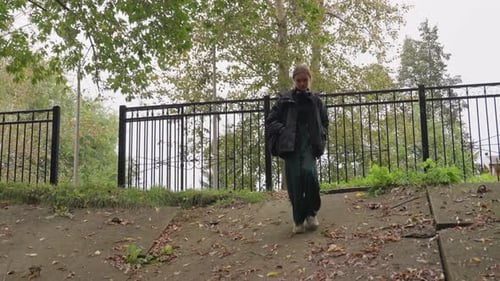 Reflective Autumn Stroll Contemplative Individual in Fall Park Environment Person Lost in Thought