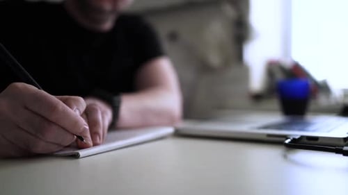 Creative Journaling: Man Working from Home Office