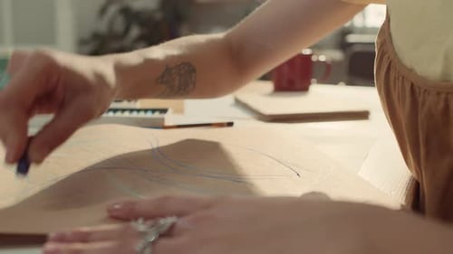 Unrecognizable Woman Drawing Sketch with Pastels in Studio
