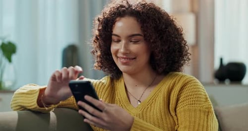 Woman, phone and website for ebook in home, scroll and reading online novel on weekend in lounge