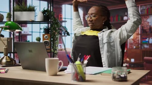 Woman Working from Home and Taking a Stretch