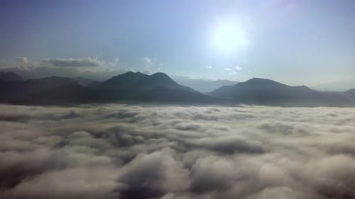 Aerial View of Clouds and Mountain Landscape