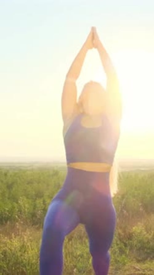 Blonde Woman Practicing Yoga Outdoors in Golden Light