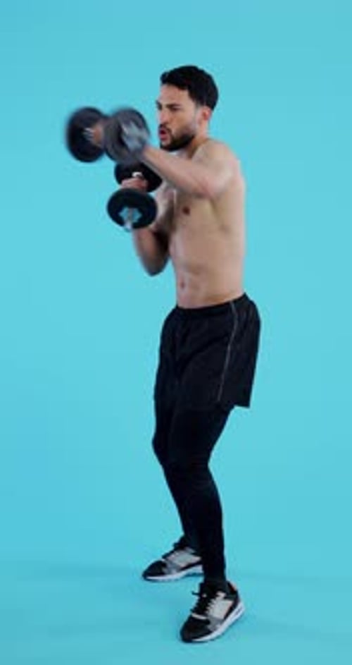 Fitness, gym and man with dumbbell for training, workout and exercise with healthy mindset and body