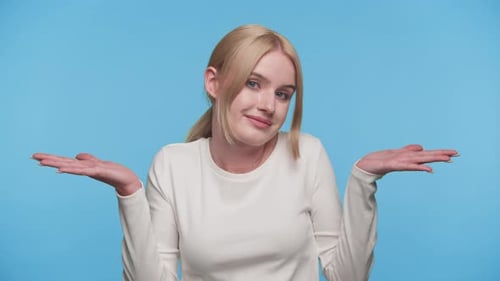 Confused Woman Making Shrug Gesture with Hands