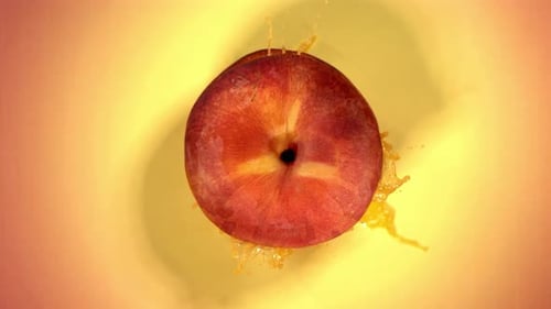 Super Slow Motion of Explosion Peach and Burst Juice