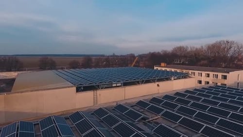 Photovoltaic solar panels on the roof at sunset.