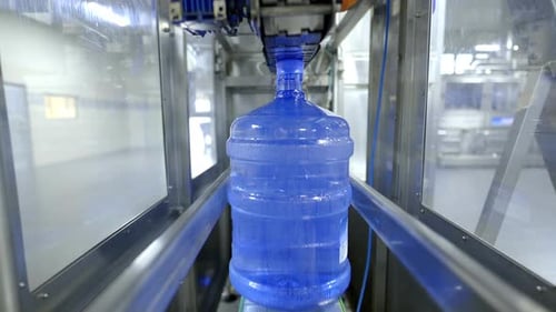 A close-up view of an automated water bottling line, showcasing the efficient and hygienic process o