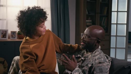 Boy and Military Father Share Heartfelt Conversation at Home