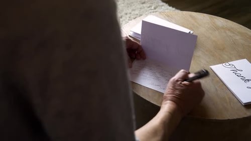 Senior Woman Writing Thank You Note