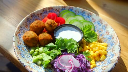 Fresh Falafel Bowl with Vibrant Veggies and Sauce