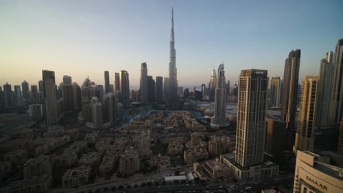 Aerial view of Dubai cityscape with Burj Khalifa at sunset, UAE.