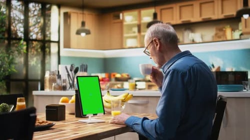 Vertical Chroma Key Tablet with Senior Man Enjoying Morning Routine