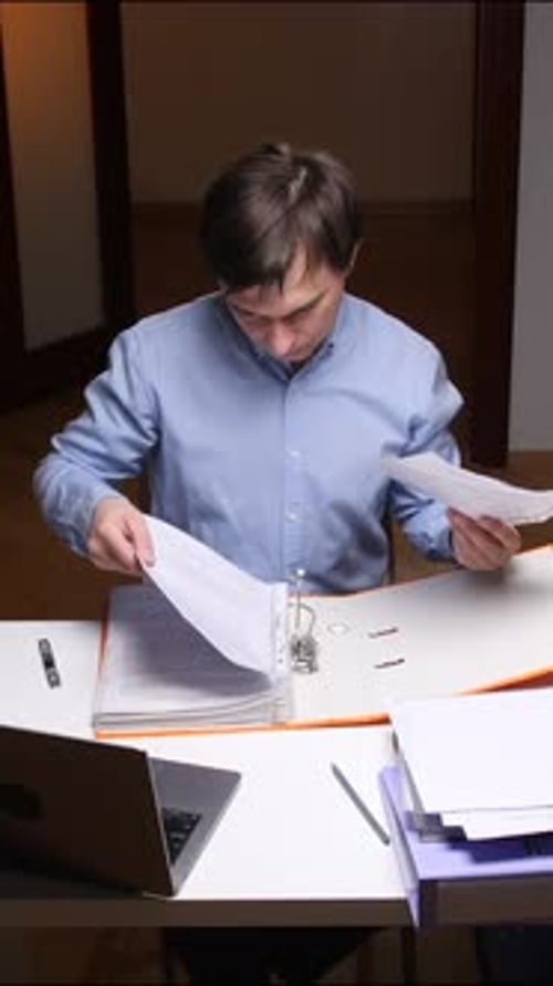 Vertical Video Office Worker Checking Documents and Filing Ring Binder at Home Office Desk