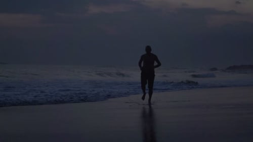 Silhouette Man Running on Tropical Beach