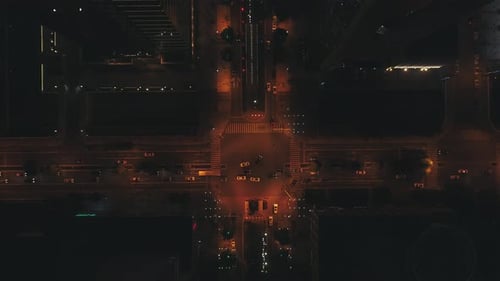 Aerial Drone Top View of Night City Road Traffic Over Big Crossroad Cars and Buses Driving By Avenue
