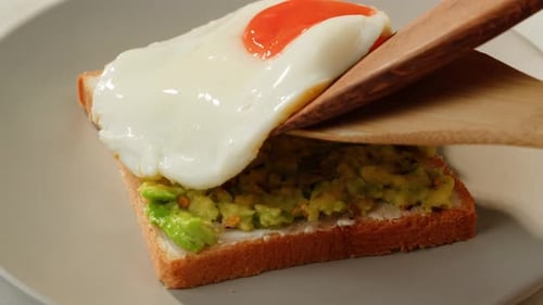 Egg Topped on Avocado Toast for Breakfast