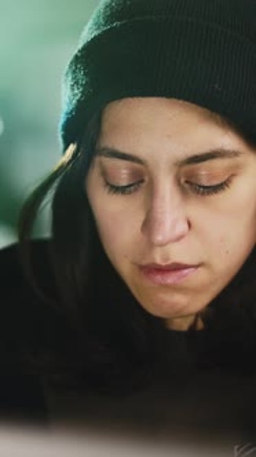 Woman Looks Down at Computer Screen Close Up